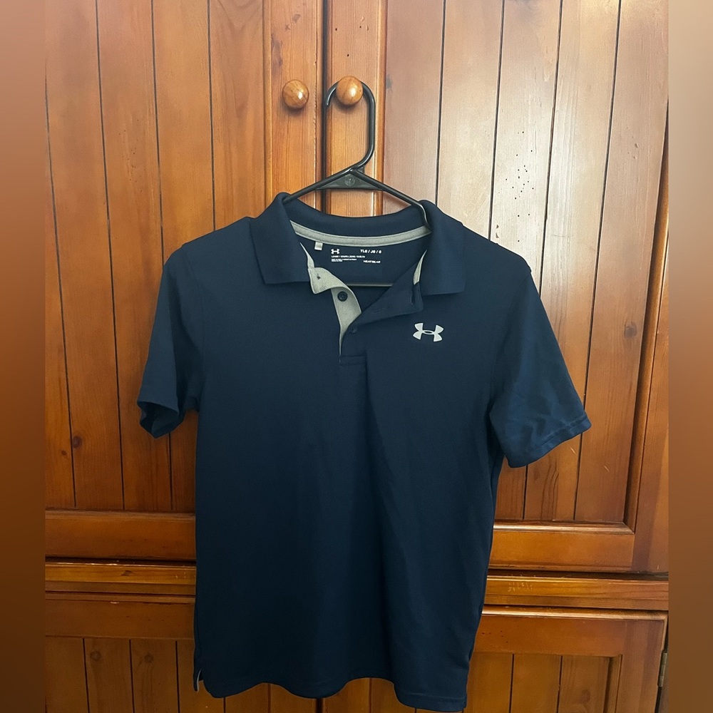 Under Armour youth large loose fit polo. HeatGear, navy blue with gray trim.